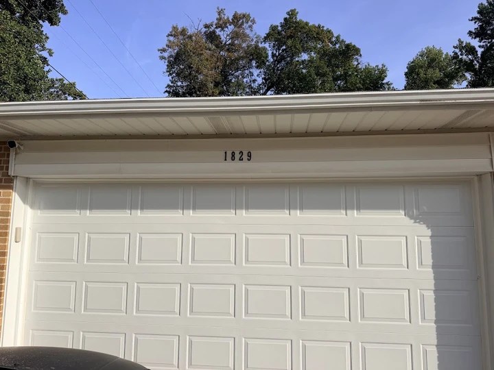 White garage door with the number 1829.