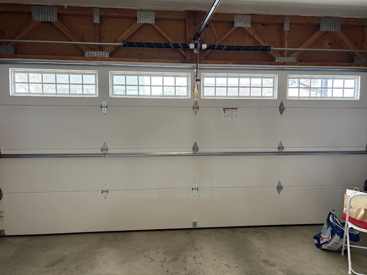 White sectional garage door with windows.