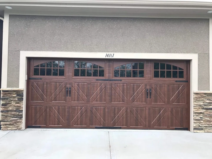 Wood-style carriage garage door by Anytime Garage.