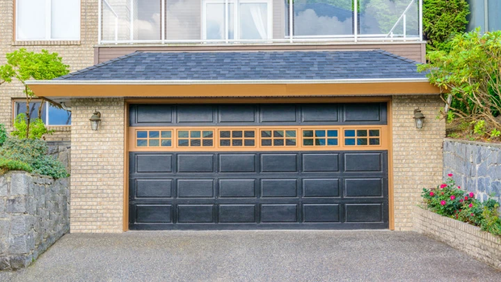 A dark garage door installed by A & R Door Service.