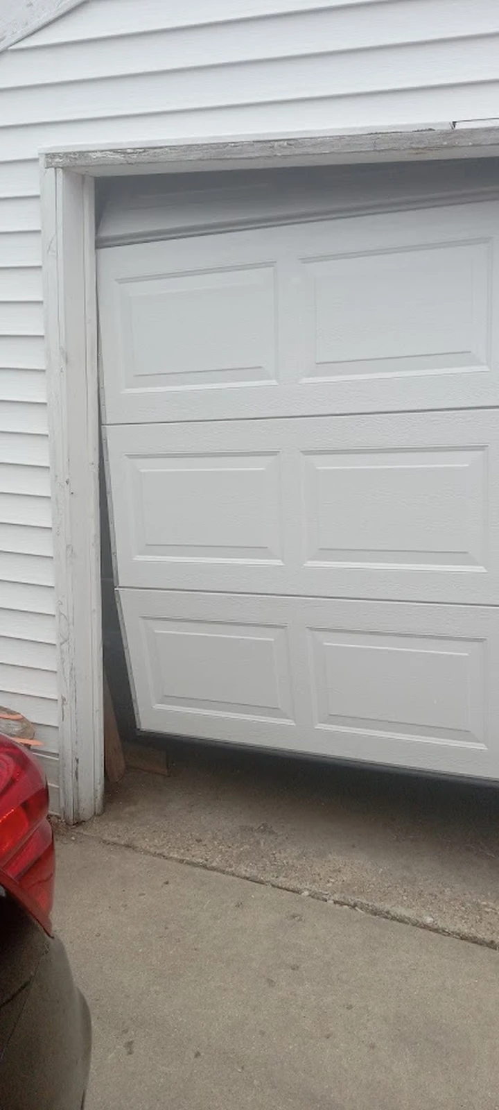 Garage door off track requiring repair.