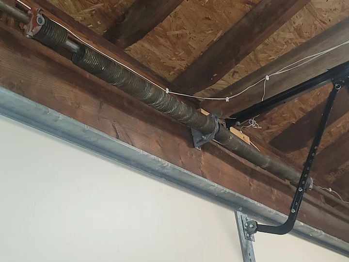 Garage door torsion spring and hardware.