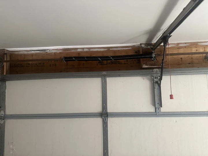Garage door torsion spring and rail system.