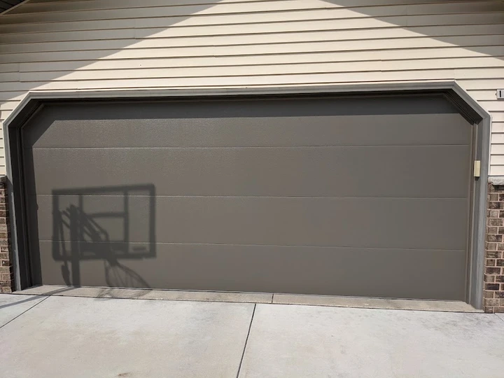 Graf's modern taupe garage door.