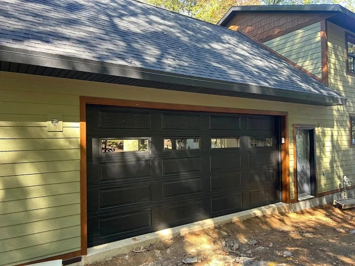 Modern black garage door installed by Overhead Doors.