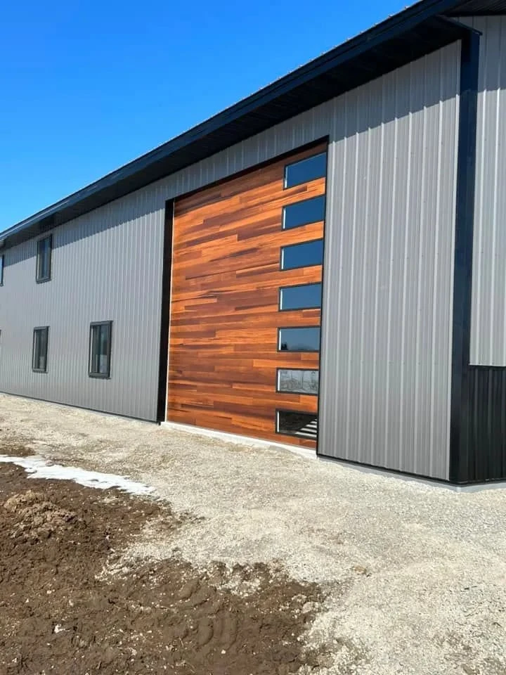 Modern wood-look overhead door with windows.